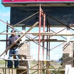 New Life Church LED and fluorescent sign under construction. Norm Stanek of Schroeder Construction is laying brick for the support pillars.